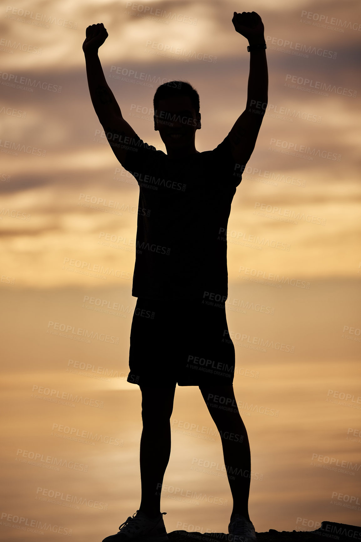 Buy stock photo Shot of a young man exercising in nature