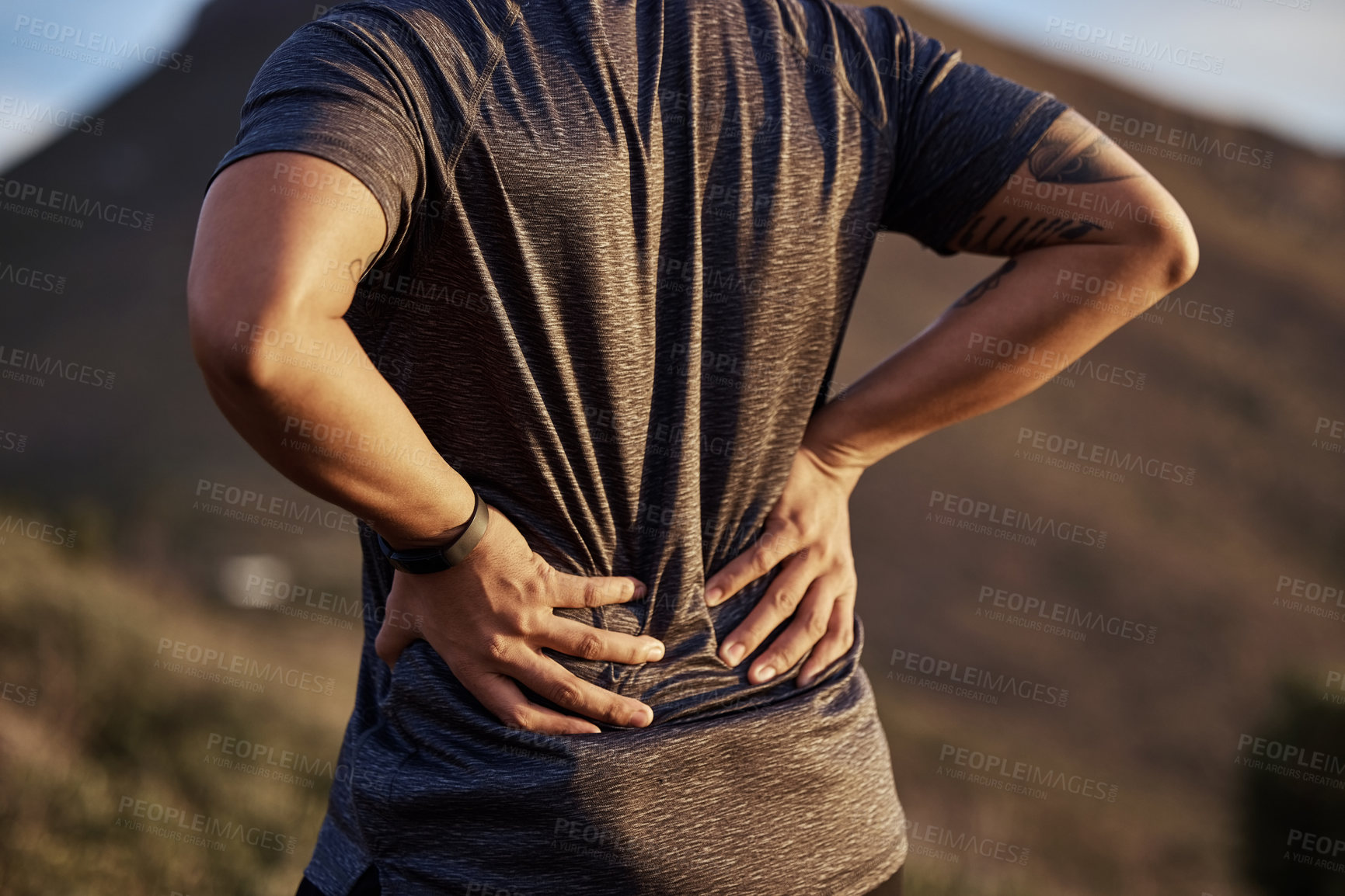 Buy stock photo Back pain, running and injury with man in nature for fitness, hiking or workout. Emergency, accident and body ache with closeup of male runner in outdoors for muscle inflammation, tension or pressure