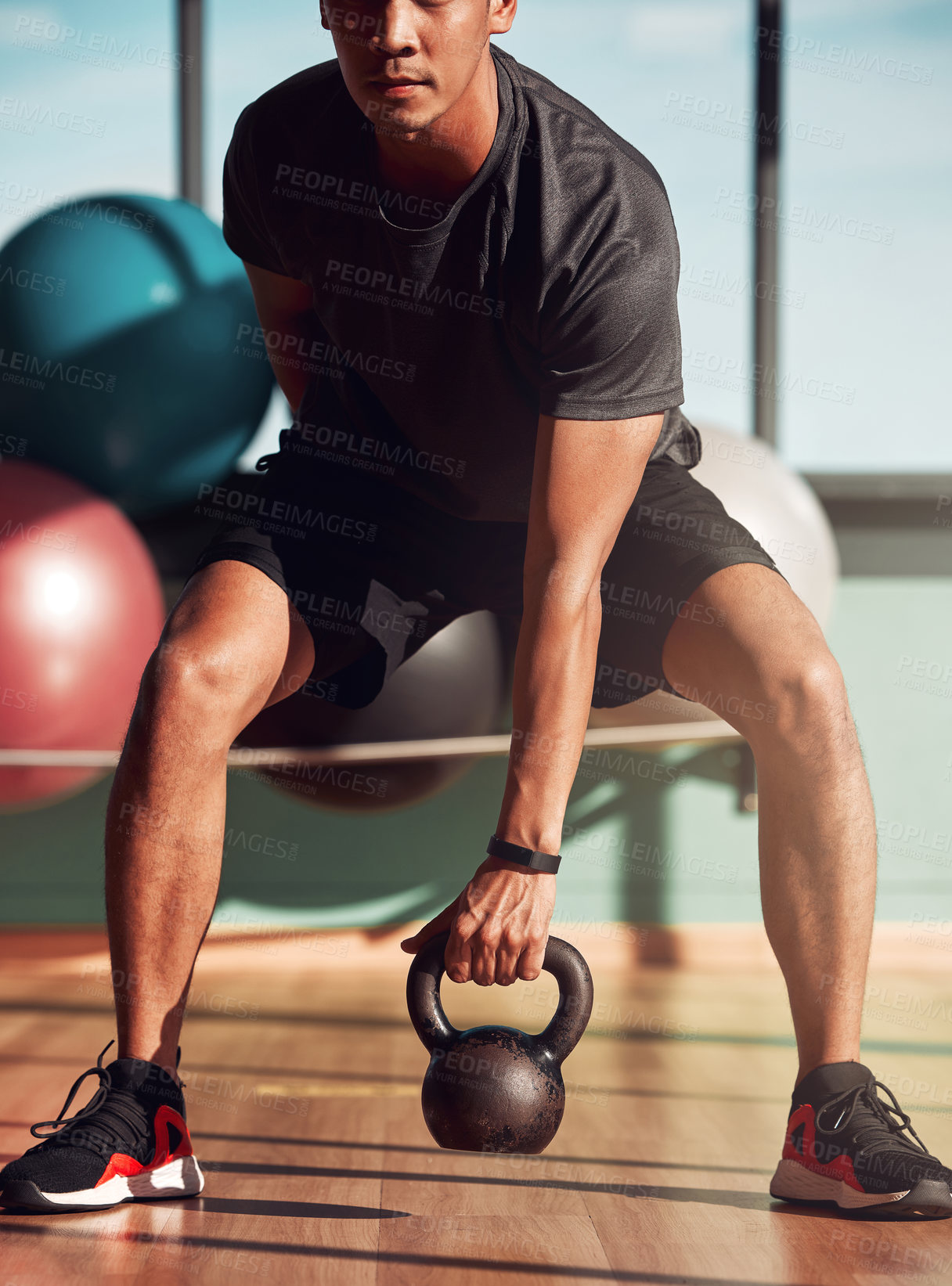 Buy stock photo Kettlebell, fitness and young man for workout, exercise or development for sport. Bodybuilder, person and athlete with energy at gym for wellness, training and healthy target for progress or goal