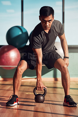 Buy stock photo Kettlebell, fitness and portrait of man for workout, exercise and development for sport. Bodybuilder, Asian person and athlete with motivation at gym for wellness, training and healthy lifestyle