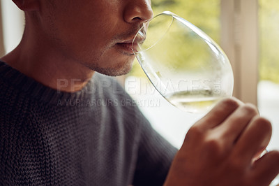 Buy stock photo Shot of a young man out wine tasting