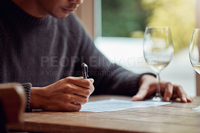 Buy stock photo Restaurant, glass and man with notes in wine tasting for review, feedback and research for article. Journalist, alcohol and paper with information at winery for analysis, criticism and evaluation