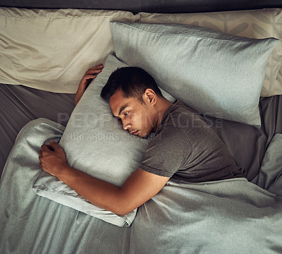 Buy stock photo Sad, tired and depression with man in bedroom for burnout, fatigue and mental health. Anxiety, lonely and depressed with male person feeling grief in bed at home for frustrated, problem and morning