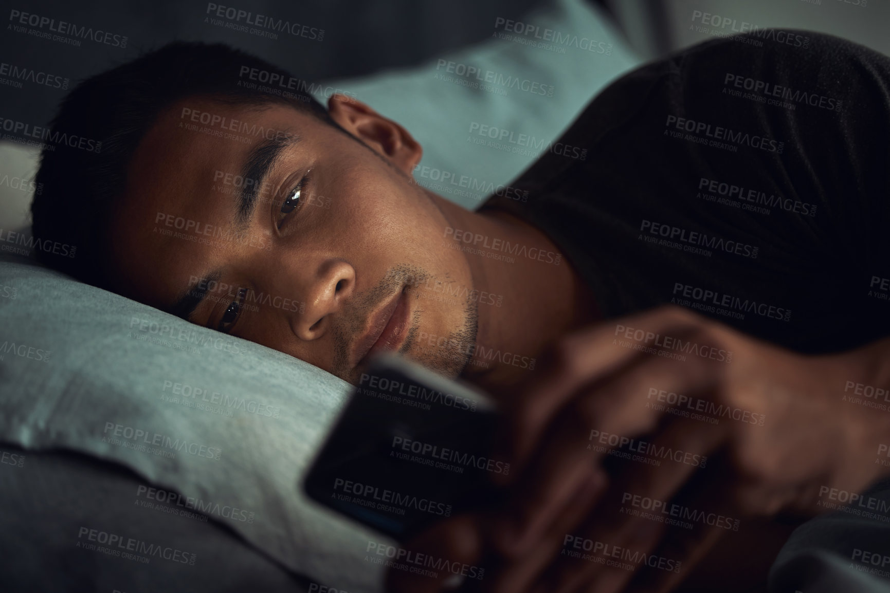 Buy stock photo Night, bed and tired man with phone, internet scroll and social media post or texting, insomnia in home. Wake up, browse and exhausted male in dark bedroom with cellphone, mobile game or digital app.