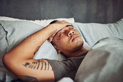 Buy stock photo Tired, rest and sick man sleeping in the bedroom while in recovery or healing in his apartment. Burnout, illness and male person with a headache or fever taking a nap in bed at his modern home.