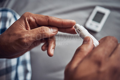Buy stock photo Person, hand and blood sugar with finger in home for diabetes to monitor insulin, glucometer or test. Medical, pen and safety or health measure as genetic problem or bad diet, wellness or diagnostic