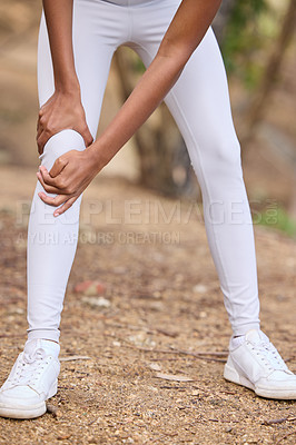 Buy stock photo Person, touch knee and sneaker for fitness, exercise or injury for cardio training in outdoor activity. Female lady and active in forest for wellness, physical pain or workout for health recreation 