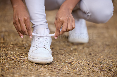 Buy stock photo Hands, hiking and tying shoes with person outdoor in nature for fitness, hobby or recreation closeup. Exercise, ground and park with hiker getting ready for sports, training or workout in park