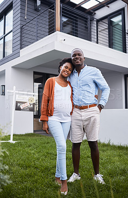 Buy stock photo Portrait of a young couple standing outside their new home
