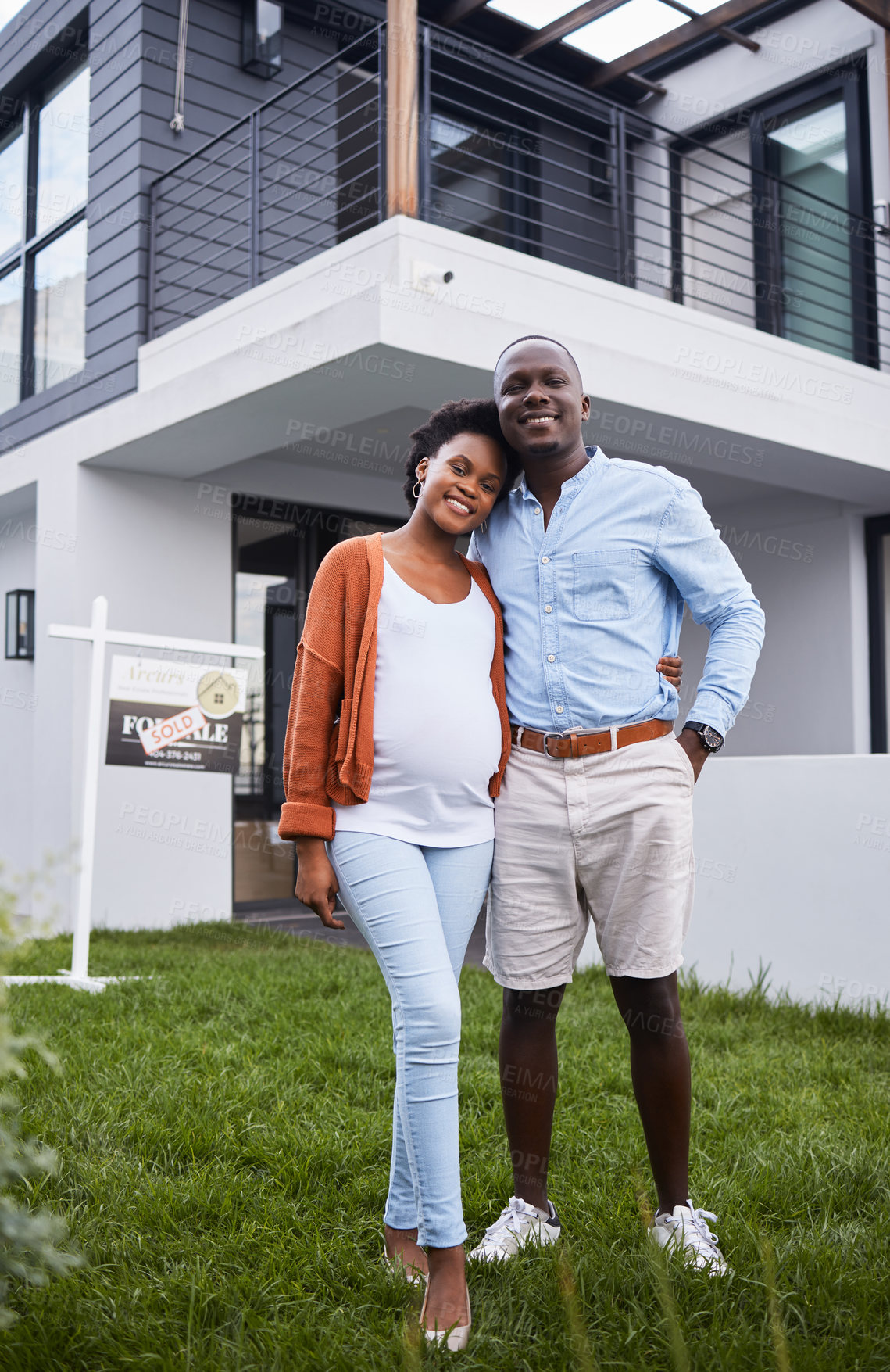 Buy stock photo Portrait of a young couple standing outside their new home