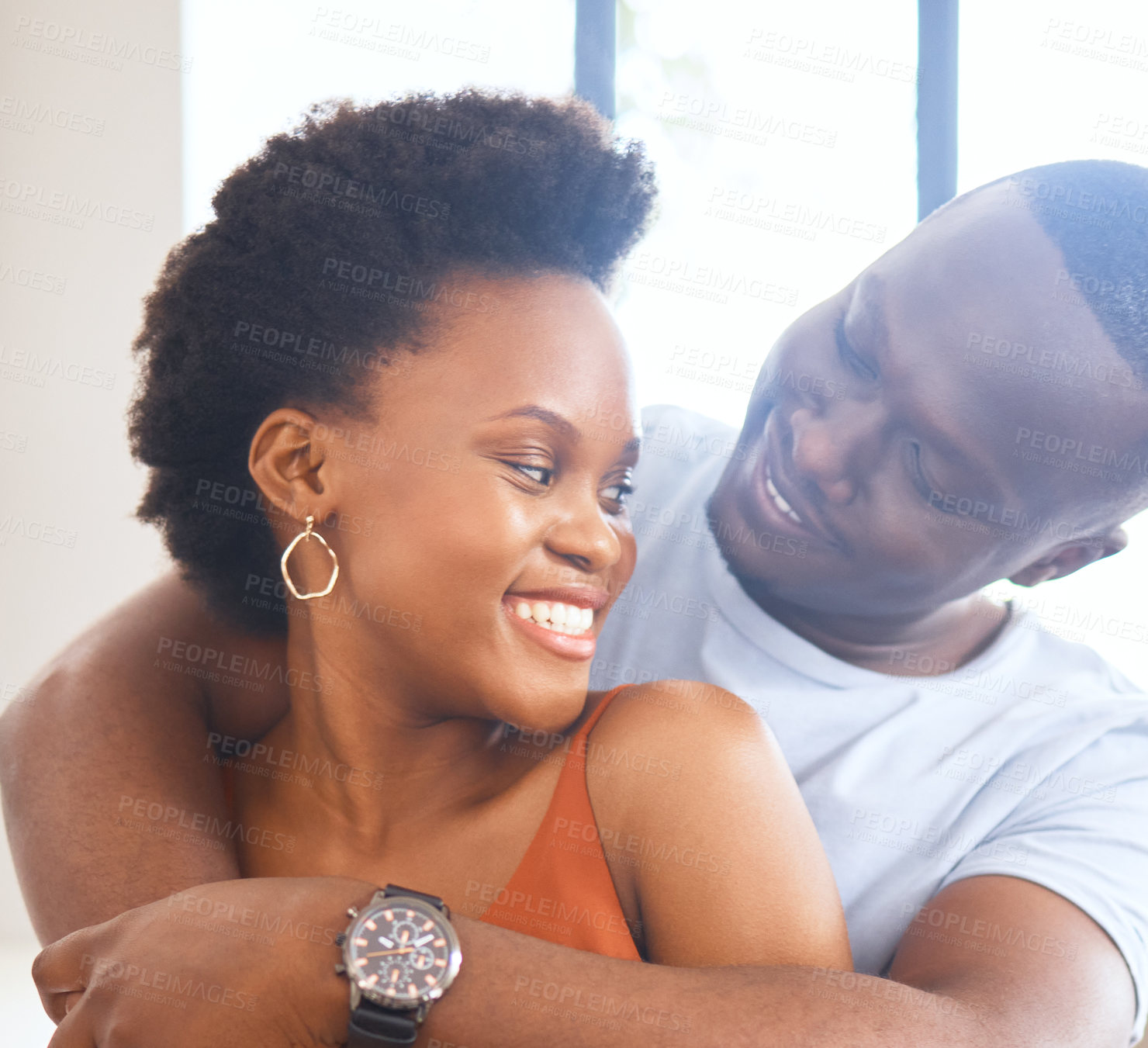 Buy stock photo Happy, african couple and hug with watch for bonding or celebration of new apartment and relationship . Smile, people and love embrace for support, trust and commitment to partner in marriage