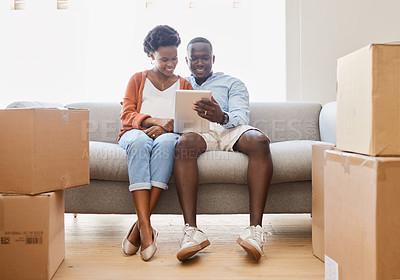 Buy stock photo Black couple, social media and tablet with love, sofa in living room of new home for browsing together. App, smile or technology with happy man and woman in apartment for internet video streaming