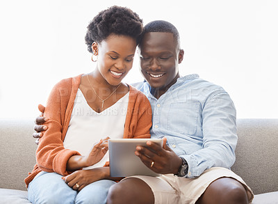 Buy stock photo App, social media and tablet with black couple on sofa in living room of home for browsing together. Love, smile or technology with happy man and woman in apartment for internet video streaming