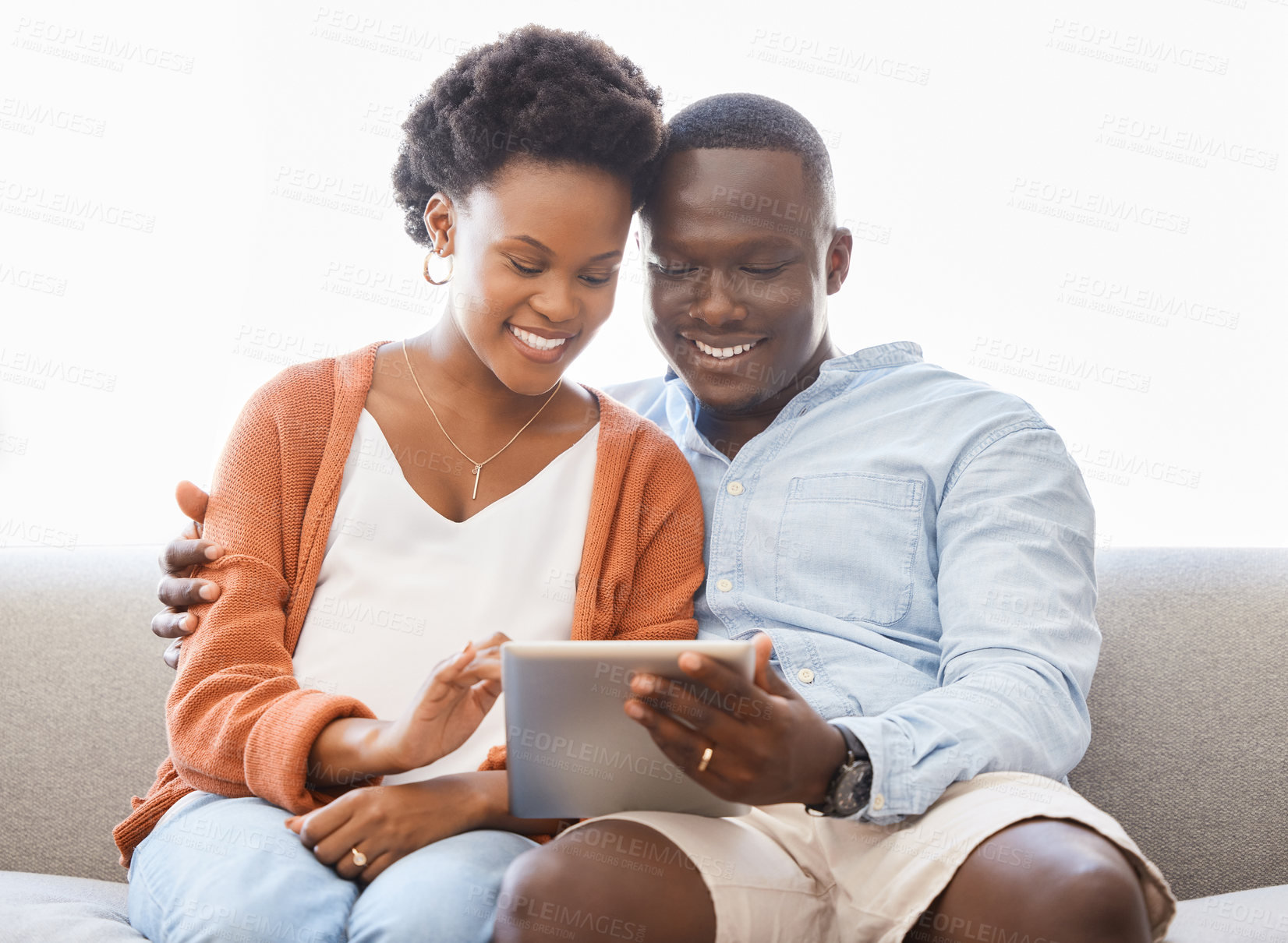 Buy stock photo App, social media and tablet with black couple on sofa in living room of home for browsing together. Love, smile or technology with happy man and woman in apartment for internet video streaming