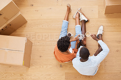 Buy stock photo African, people and boxes in pregnancy in excited for moving, house and relocating on floor in above. Woman, man and tea as happy for sonogram of baby in new home or property as married couple
