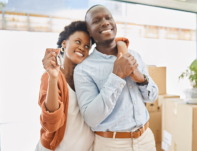 Buy stock photo Black couple, keys and boxes with new home, love and hug in living room of house for living together. Romance, smile and mortgage with man and woman in apartment for future investment opportunity