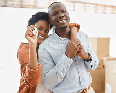 Buy stock photo Black couple, keys and boxes with new home, love and hug in living room of house for living together. Romance, smile and mortgage with man and woman in apartment for future investment opportunity