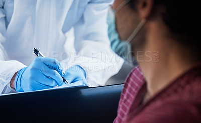 Buy stock photo Shot of a doctor recording a patients information for a drive through vaccination