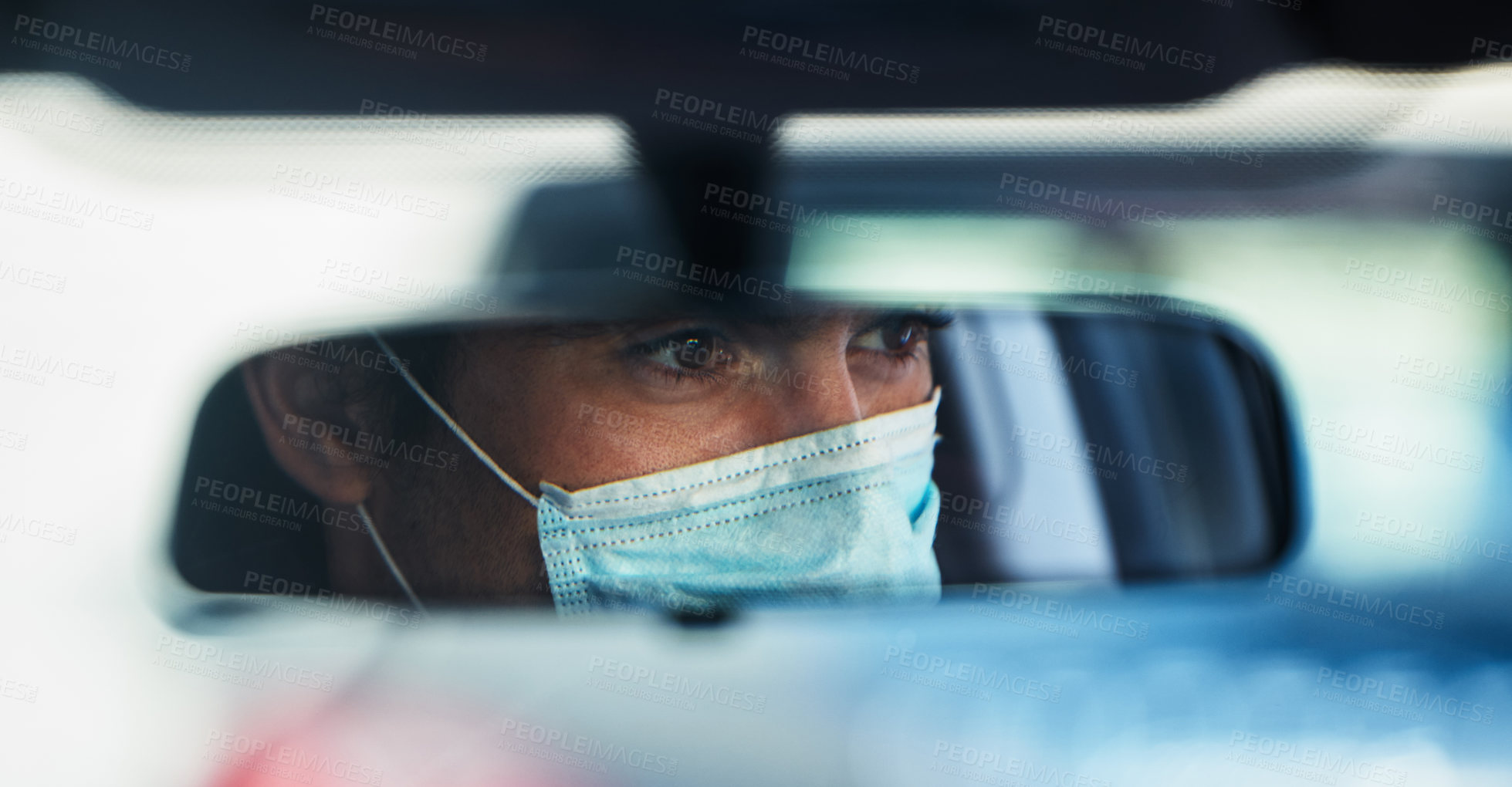 Buy stock photo Man, driving and face mask in rear view mirror for contagious infection, reflection or disease. Male person, car and mobile vaccination in drive thru for healthcare safety or sick, epidemic or virus