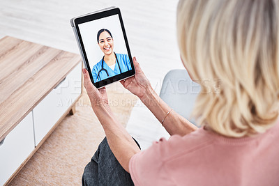 Buy stock photo Shot of a woman on a video call with a medical practitioner