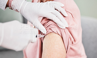 Buy stock photo Shot of a patient receiving an injection in her arm