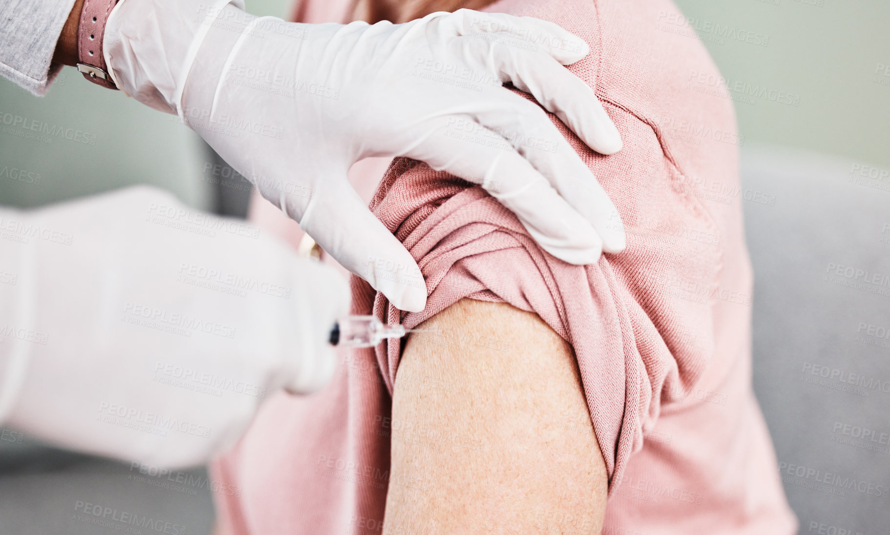 Buy stock photo Shot of a patient receiving an injection in her arm