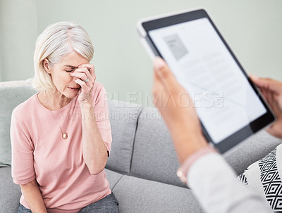 Buy stock photo Shot of a senior woman looking upset during a consultation