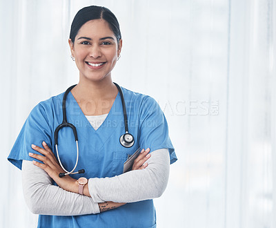 Buy stock photo Shot of a medical practitioner standing with her arms crossed