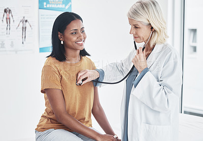 Buy stock photo Woman, doctor and stethoscope with consultation, healthcare and discussion for treatment, test or diagnosis. Female person, patient or medical professional with cardiology, heartbeat and conversation