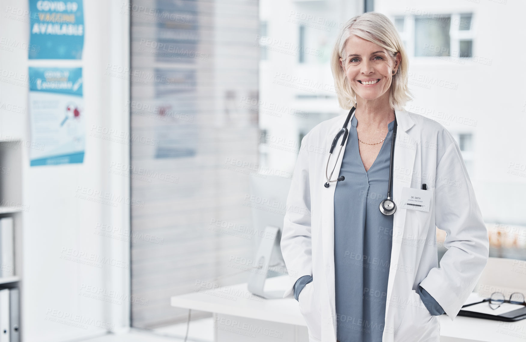 Buy stock photo Portrait of a confident mature doctor working at a clinic