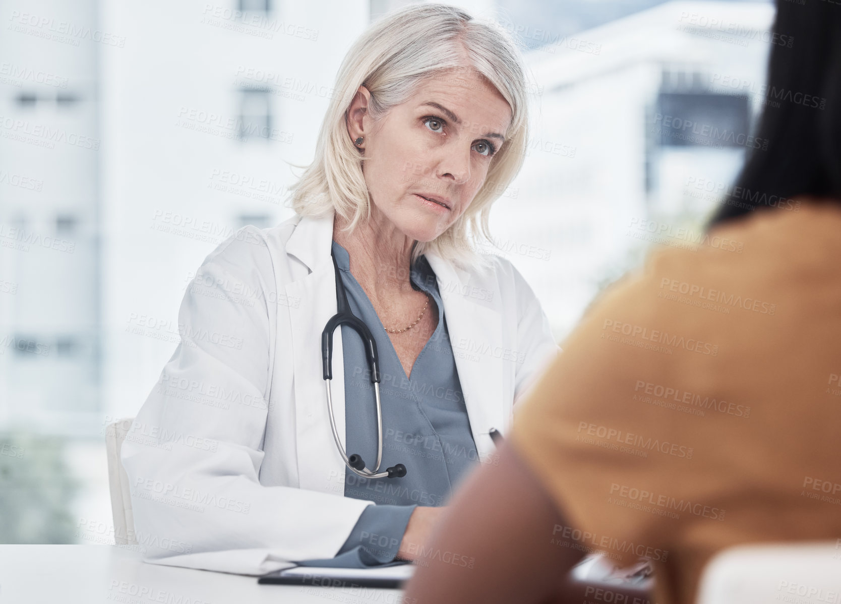 Buy stock photo Healthcare, mature woman or doctor for consultation, checkup and appointment with patient. Hospital, medical employee and paper for prescription, checklist and asking questions for feedback in clinic