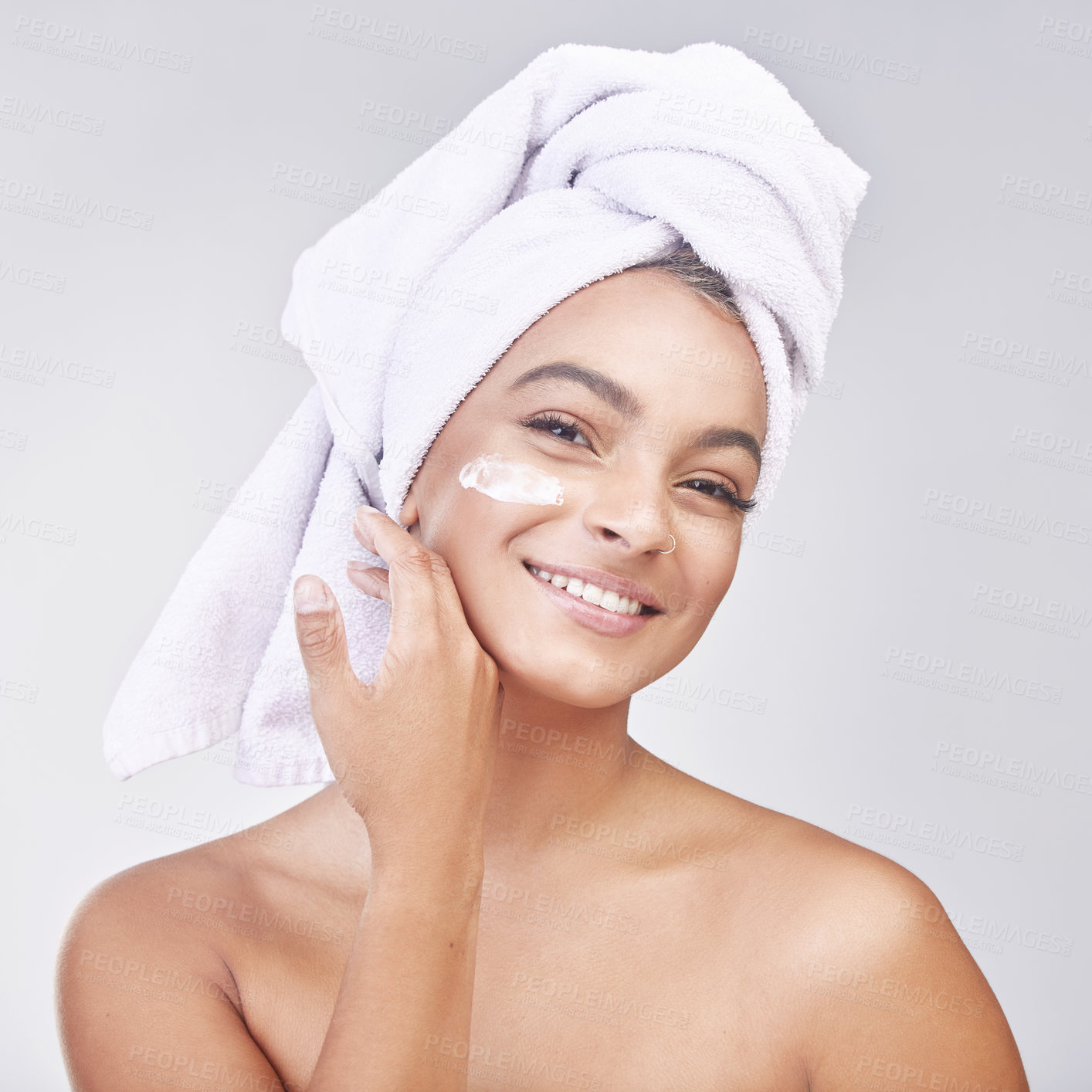 Buy stock photo Happy woman, portrait and skincare with cream or ointment for hygiene on a gray studio background. Face of female person or young model with smile for lotion, anti aging or healthy facial treatment