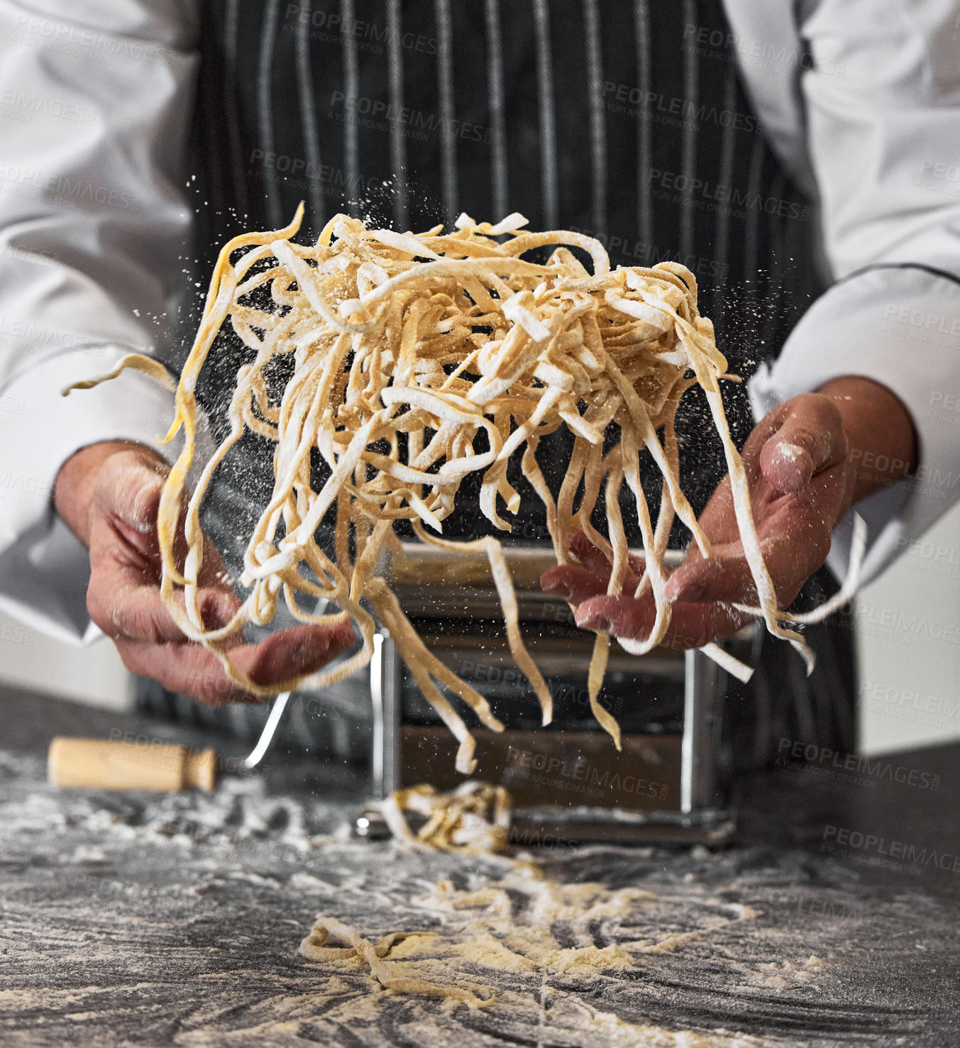 Buy stock photo Shot of an unrecognisable man preparing freshly made pasta