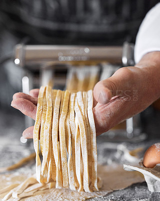 Buy stock photo Shot of an unrecognisable man preparing freshly made pasta