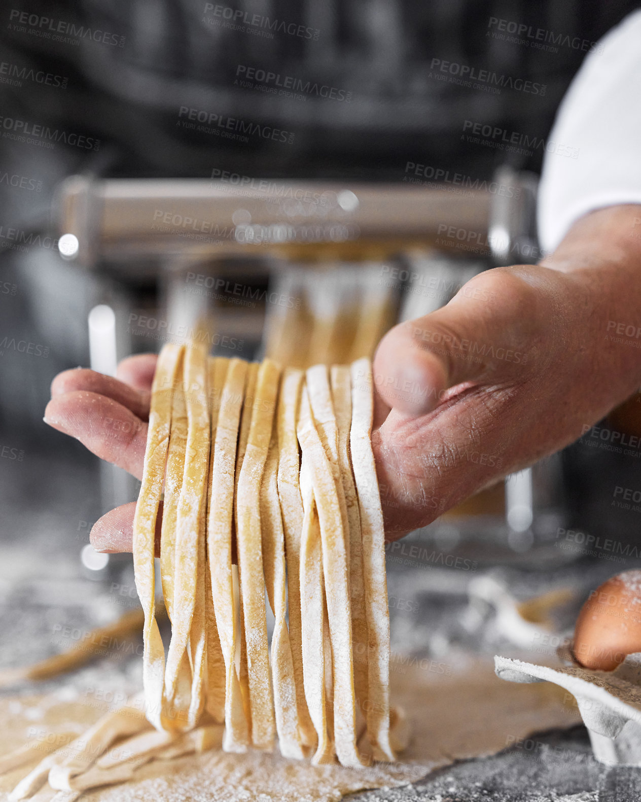 Buy stock photo Shot of an unrecognisable man preparing freshly made pasta