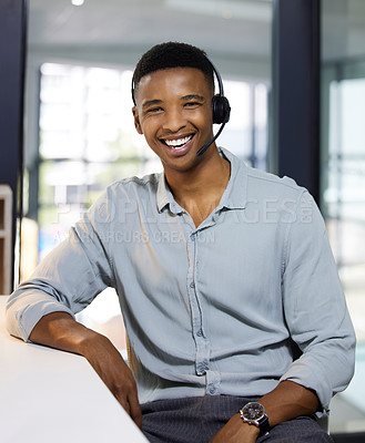 Buy stock photo Portrait of a young man using a headset in a modern office