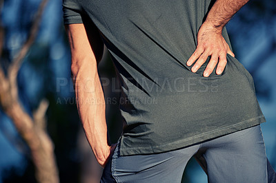 Buy stock photo Hands, back pain and fitness injury outdoor after accident, exercise or sports workout at night. Spine, problem and athlete man with arthritis, fibromyalgia or emergency, muscle wound or osteoporosis