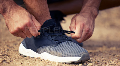 Buy stock photo Fitness, hands and runner tie shoes outdoor to start running, exercise or workout. Hand, athlete and man tying sneakers to get ready for cardio, training or exercising for sports, health and wellness