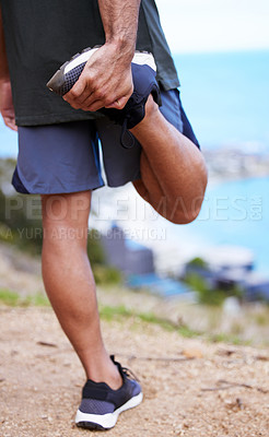 Buy stock photo Fitness, legs and man stretching by ocean before workout or morning training routine for race or wellness. Person, thinking and outdoor with exercise for warm up for marathon, cardio and health.