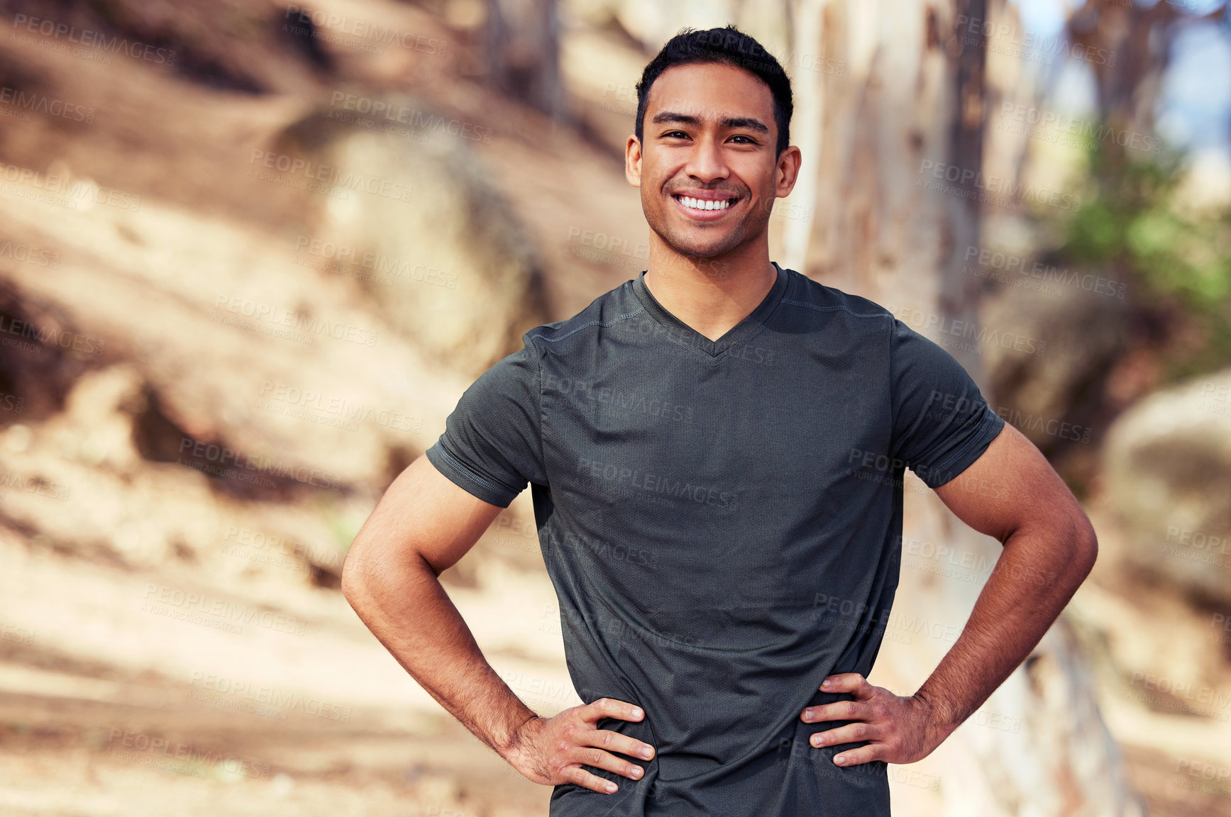 Buy stock photo Portrait of a sporty young man exercising outdoors