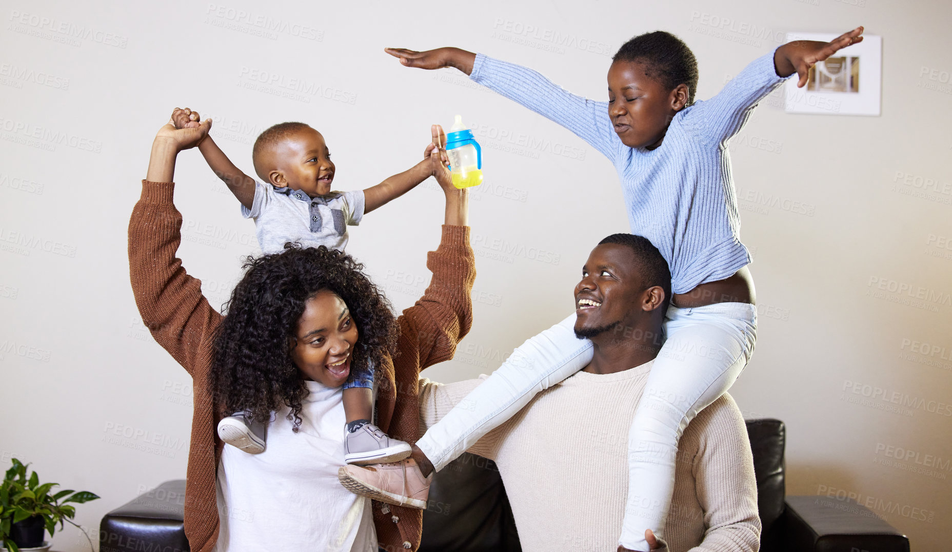 Buy stock photo Black family, home and playing with smile, airplane and love with happiness. Mother, father and children with sofa, lounge and game for fun and joy with kids for childhood memories in living room