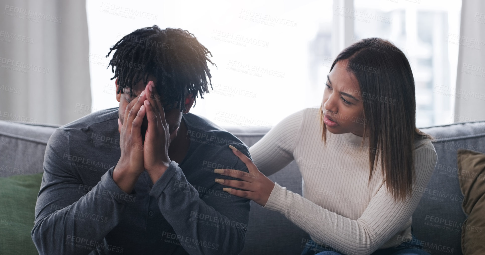 Buy stock photo Shot of a young couple having an argument at home