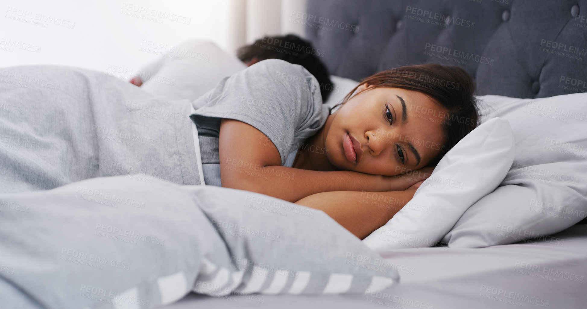 Buy stock photo Sad woman, bed and couple in a bedroom lying depressed after fight in the morning. Conflict, depression and fighting of a female person with partner together in a home thinking of divorce problem