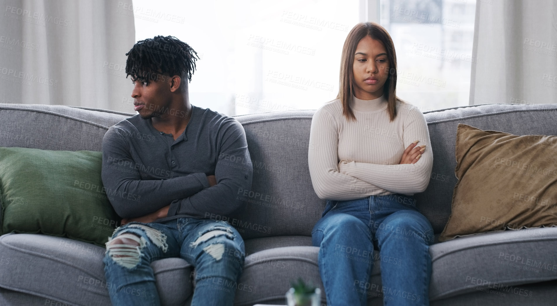 Buy stock photo Shot of a young couple having an argument at home