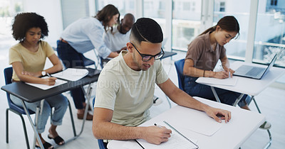 Buy stock photo Education, exam and university students with diversity in classroom for learning, test or studying. Young people, writing and college learner together for scholarship for future career or development