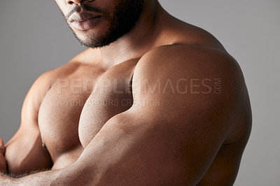 Buy stock photo Studio shot of a unrecognizable muscular man posing against a grey background