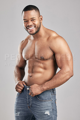 Buy stock photo Portrait, muscle and happy black man with abs for fitness, exercise or body health isolated on white studio background. Abdomen, shirtless or strong bodybuilder in jeans for fashion, sport or workout