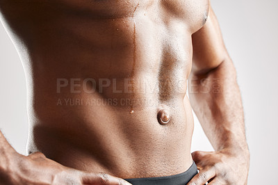 Buy stock photo Studio shot of a unrecognizable muscular man posing against a grey background