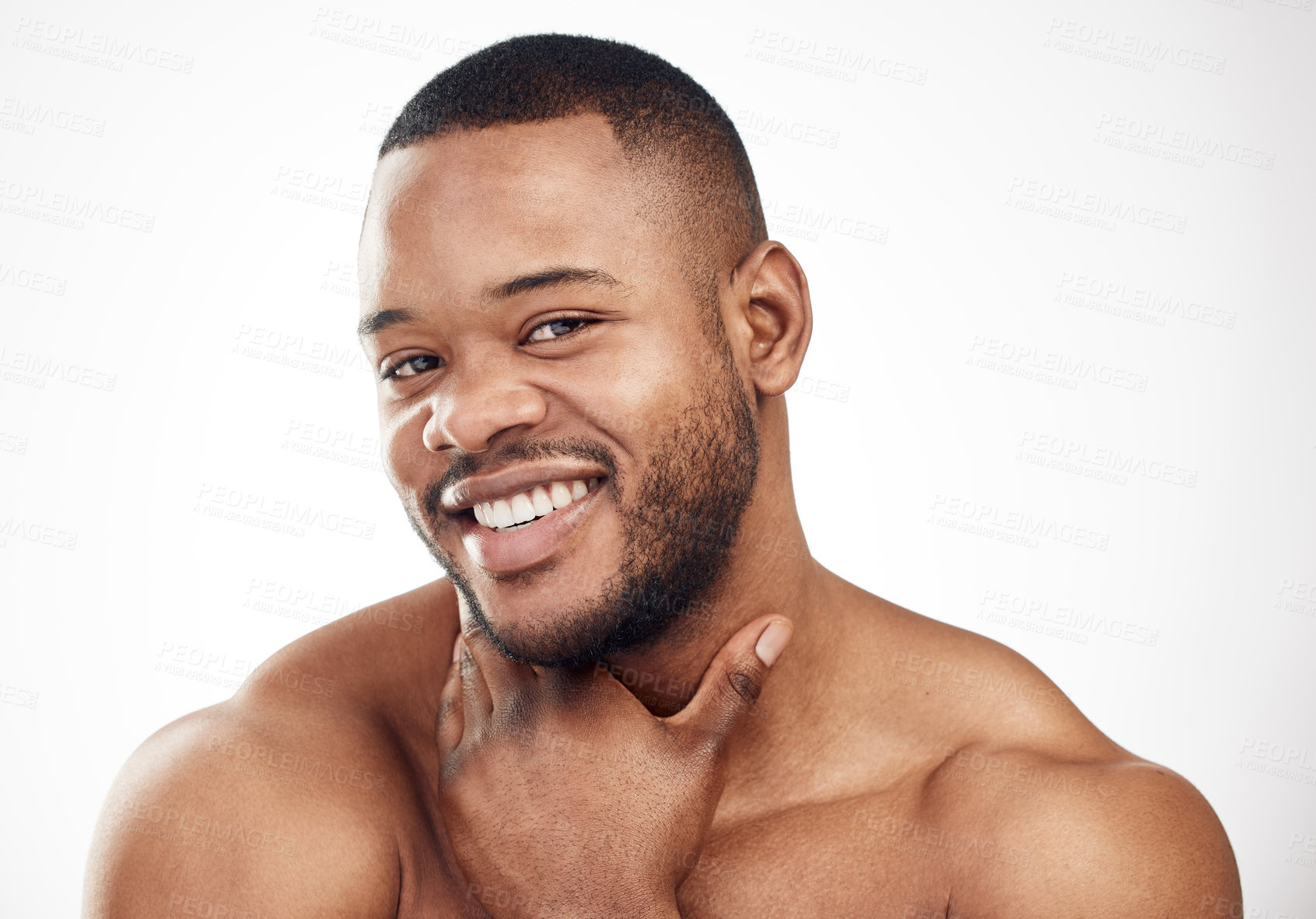 Buy stock photo Studio portrait of a handsome young man posing against a white background