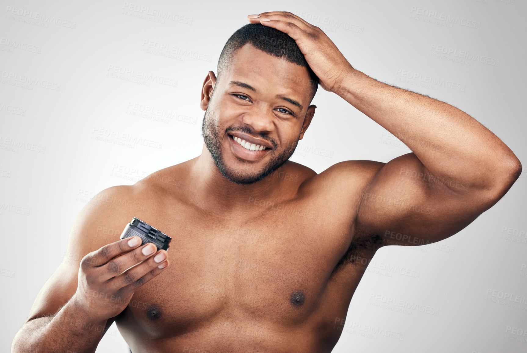 Buy stock photo Happy, african man and hair care with styling gel for morning routine and grooming isolated in studio. Smile, male person and hand on head with wax and keratin treatment for growth and hygiene